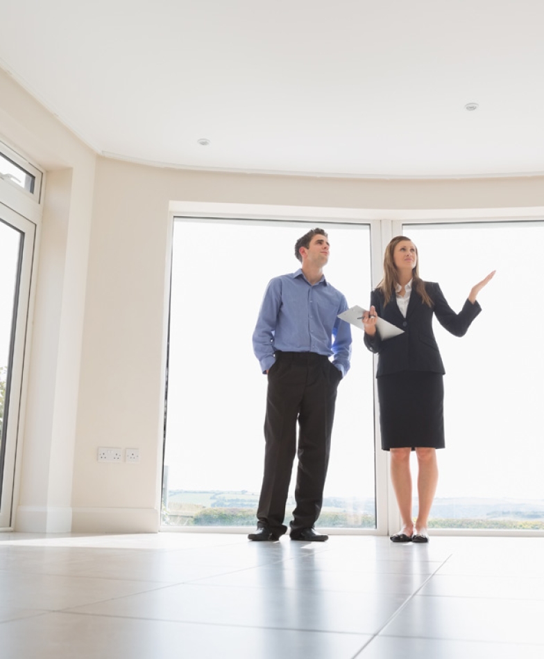 Woman presenting the rooms in new house